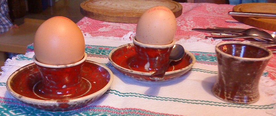Three egg cups, with saucer and without